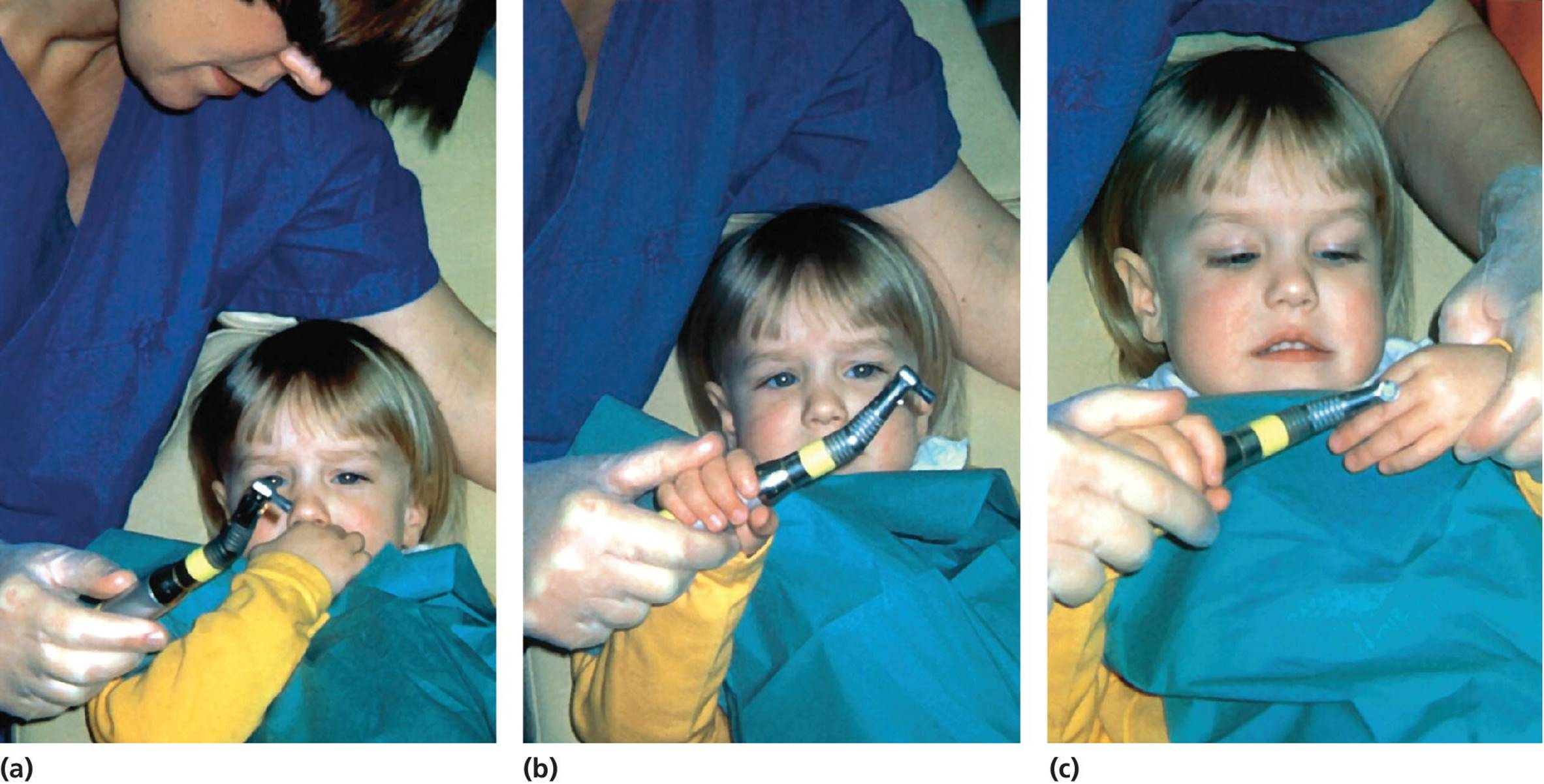 Photos of the same 3-year-old girl at her first dental visit, displaying low-speed polisher demonstrated to her by a dentist (a), being held by her (b), and polishing her finger nail (c).